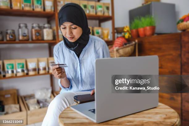 restocking before reopening the store - indonesia business stock pictures, royalty-free photos & images