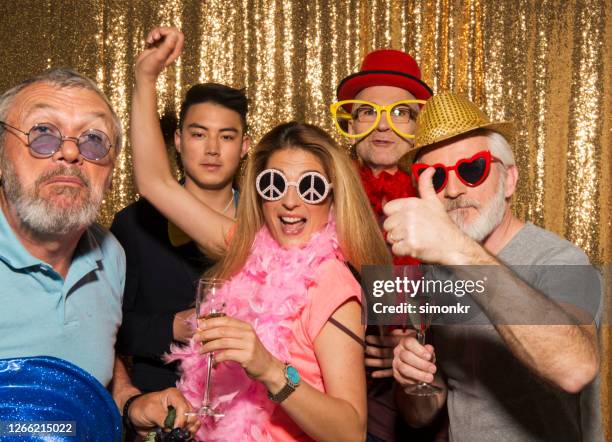 friends enjoying party - photo booth sign stock pictures, royalty-free photos & images
