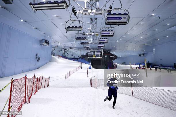 Runner competes in the DXB Snow Run during DXB Snow Week at Ski Dubai on August 14, 2020 in Dubai, United Arab Emirates.