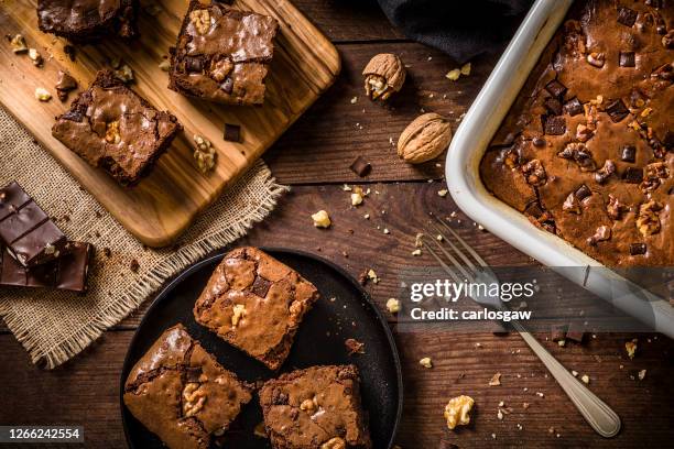 homemade chocolate brownie on a rustic wooden table - chocolate cake above stock pictures, royalty-free photos & images