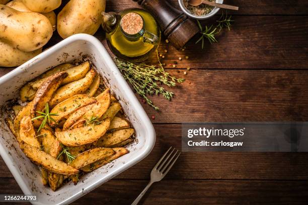 baked potatoes on a baking sheet - baked goods top view stock pictures, royalty-free photos & images