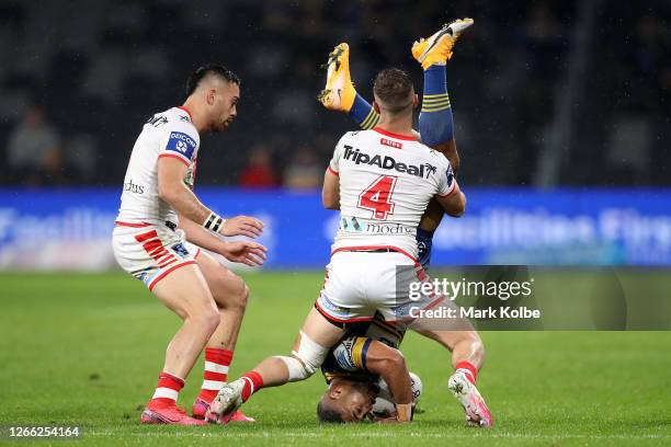 Michael Jennings of the Eels is tackled during the round 14 NRL match between the Parramatta Eels and the St George Illawarra Dragons at Bankwest...