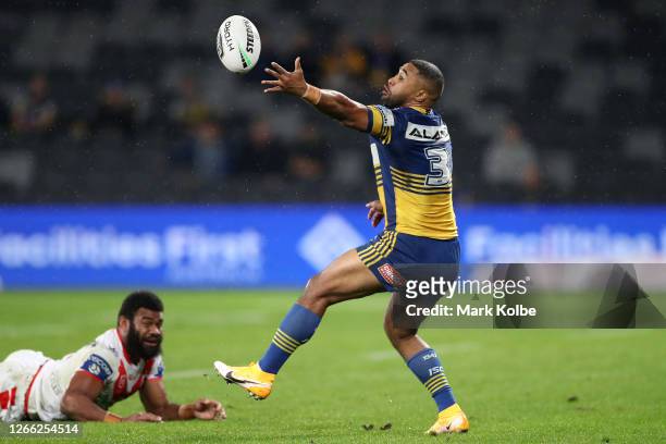 Michael Jennings of the Eels attempts to catch the ball during the round 14 NRL match between the Parramatta Eels and the St George Illawarra Dragons...