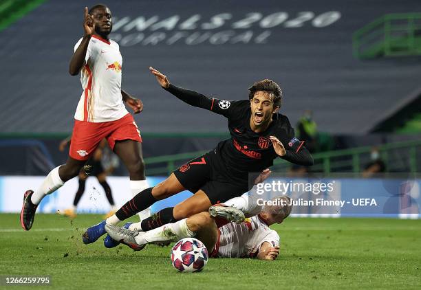 Joao Felix of Atletico de Madrid is fouled by Lukas Klostermann of RB Leipzig inside the penalty area leading to Atletico de Madrid being awarded a...