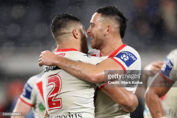 Corey Norman of the Dragons and Tyrell Fuimaono of the Dragons celebrate winning the round 14 NRL match between the Parramatta Eels and the St George...