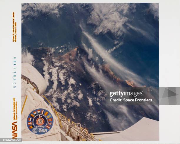 The port-side Orbital Manoeuvring System pod and a portion of the Spacelab 1 module on the Space Shuttle Columbia, during NASA's STS-9 mission, 1983....