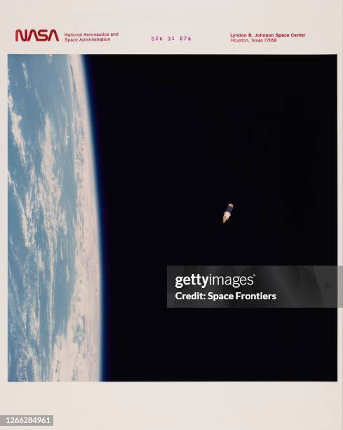 The Tracking and Data Relay Satellite in a geosynchronous orbit above the Earth minutes after its deployment from the cargo bay of the Space Shuttle...