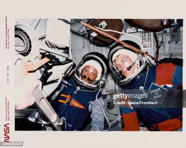 Mission specialists Norman E Thagard and Mark C Lee participate in a 10.2 cabin depress test aboard the Space Shuttle Atlantis in Earth orbit, on...