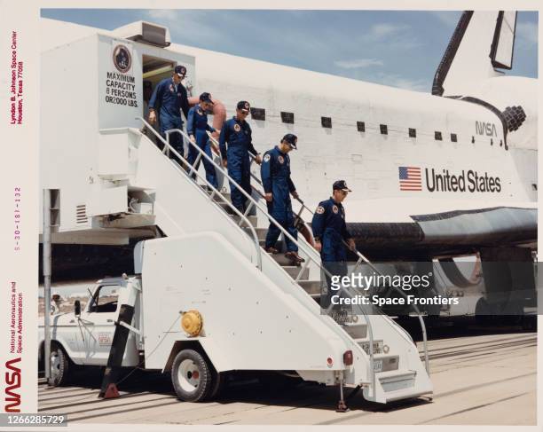 The crew of NASA's STS-30 mission leave the Space Shuttle Atlantis, Orbiter Vehicle 104, at Edwards Air Force Base in California, after landing on...