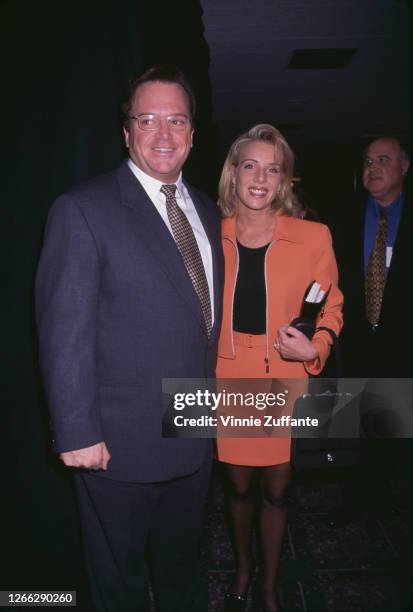 American actor and comedian Tom Arnold and his wife Julie at the 1996 NATO /ShoWest convention in Las Vegas, Nevada, March 1996.
