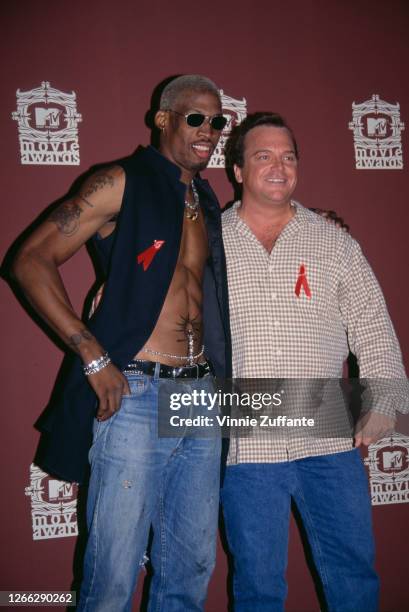 American basketball player Dennis Rodman and American actor and comedian Tom Arnold at the MTV Movie Awards at the Sony Pictures Studios in Culver...