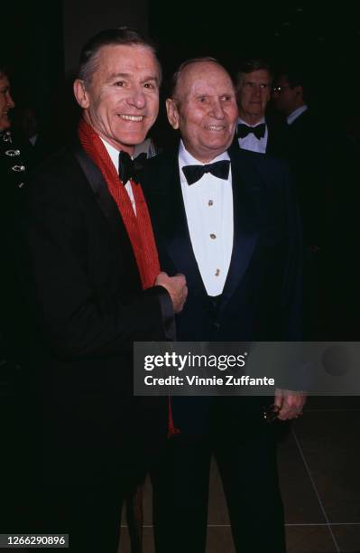 English-American actor Roddy McDowall with American singer and actor Gene Autry at the 7th Annual American Cinema Awards at the Beverly Hilton Hotel...