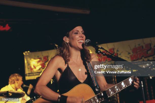 American singer, songwriter and musician Sheryl Crow performs at a WPLJ 95.5 radio event, USA, circa 1995.