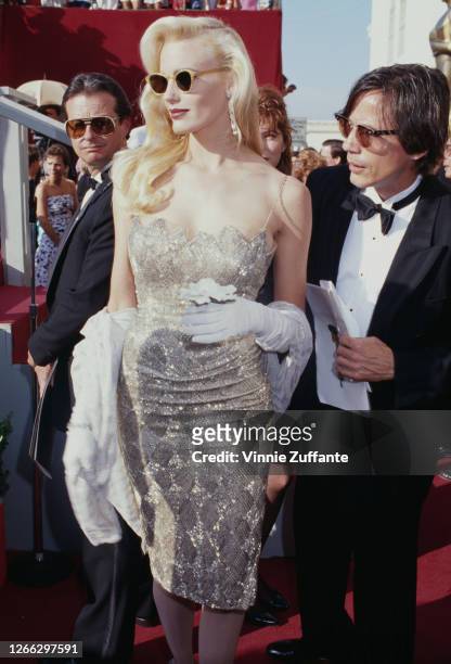 American actress Daryl Hannah and her partner, musician Jackson Browne at the 60th Academy Awards in Los Angeles, California, 11th April 1988.