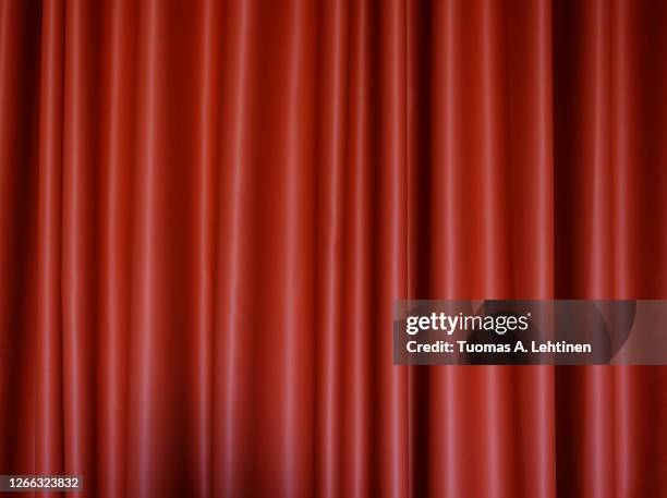 front view of a folded red polyester curtain. - polyester stock pictures, royalty-free photos & images
