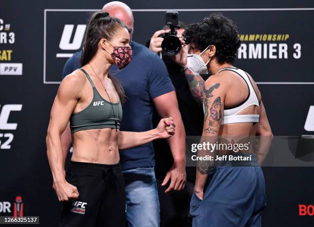 Opponents Felice Herrig and Virna Jandiroba of Brazil face off during the UFC 252 weigh-in at UFC APEX on August 14, 2020 in Las Vegas, Nevada.