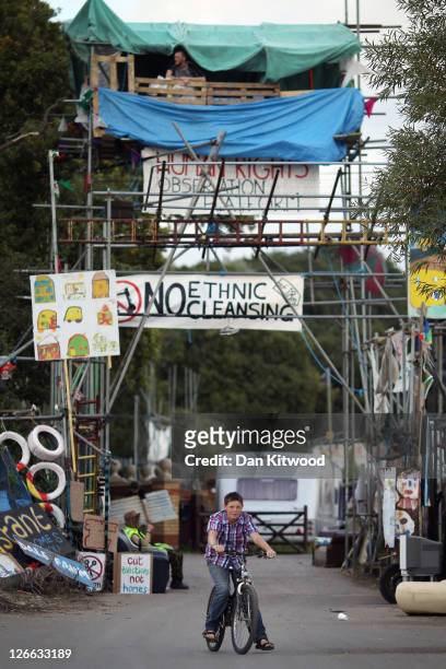 Young resident cycles through the main gate of the Dale Farm travellers' camp at Crays Hill on September 26, 2011 near Basildon, Essex, England. The...
