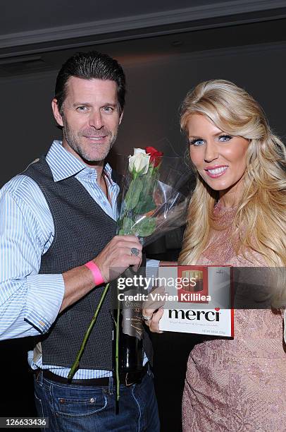 Slade Smiley and Gretchen Rossi attend ABC's "Extreme Makeover: Home Edition" Season 9 Premiere on September 25, 2011 in Los Angeles, California.