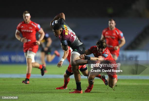 Nathan Earle of Harlequins is tackled by Tom Curry of Sale Sharks during the Gallagher Premiership Rugby match between Harlequins and Sale Sharks at...