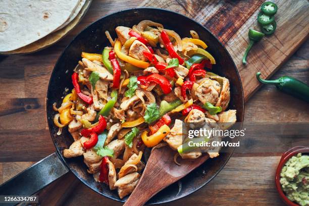 fajitas de pollo chicken marinated tortillas with onions and peppers - chicken meat stock pictures, royalty-free photos & images
