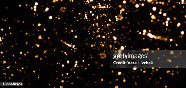 blurred bokeh light background, christmas and new year holidays background - bling bling stock pictures, royalty-free photos & images