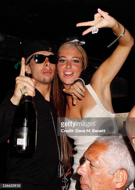 Tulisa Contostavlos poses with her cousin Dappy from N-Dubz as they attend a party to celebrate Dappy's new single 'No regrets' topping the singles...