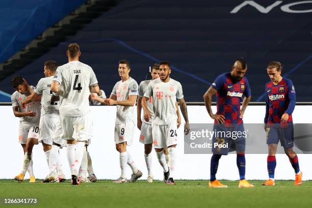 Philippe Coutinho of FC Bayern Munich celebrates with teammates after scoring his team's eighth goal during the UEFA Champions League Quarter Final...