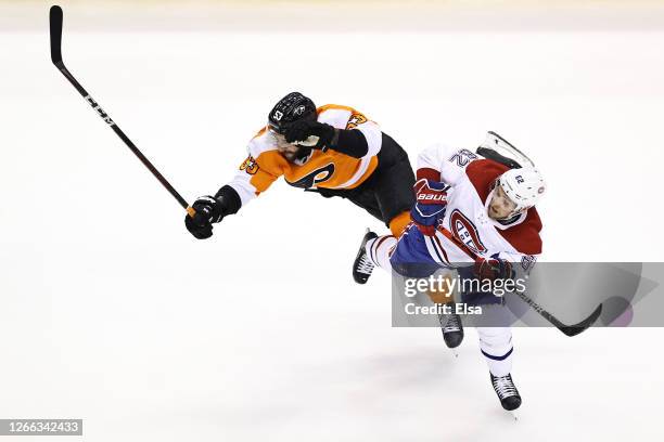 Shayne Gostisbehere of the Philadelphia Flyers collides with Artturi Lehkonen of the Montreal Canadiens during the second period in Game Two of the...