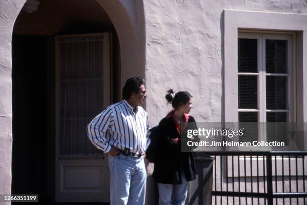 Robert Kardashian and his daughter Kim Kardashian stand outside of her private high school, Marymount High School in Los Angeles, 1996.