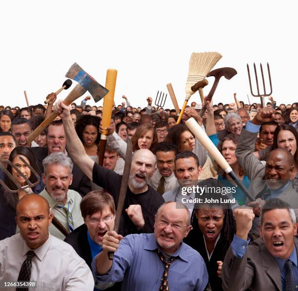 angry crowd on white - pitchfork stock pictures, royalty-free photos & images