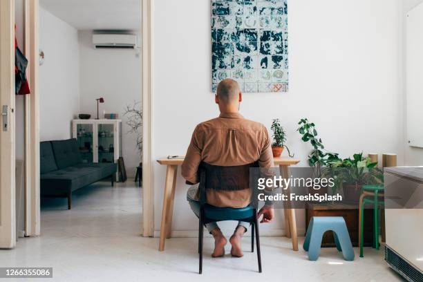 new office space: man working from home - quarantine stock pictures, royalty-free photos & images