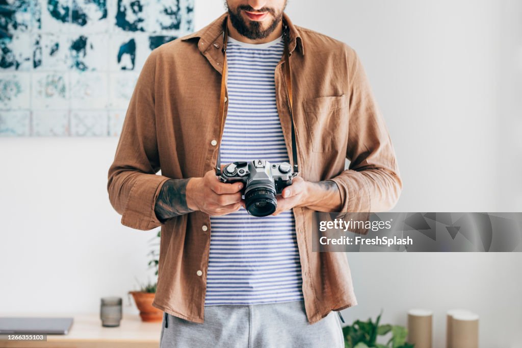 Hands of an Anonymous Man Holding an Analog Camera, Hobbies Concept