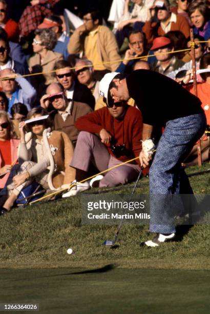 Golfer Dave Stockton of the United States hits his putt from the grass during a golf event circa 1970.