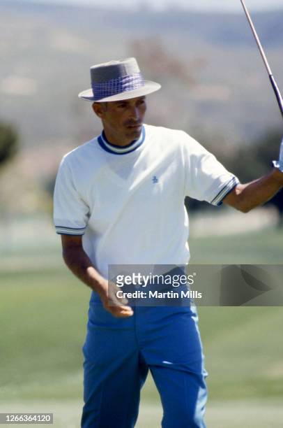 Golfer Chi Chi Rodriguez of Puerto Rico reacts to his putt during a golf tournament circa 1970.