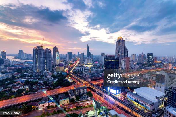 aerial view of bangkok modern office buildings, condominium, living place in bangkok city downtown with sunset scenery, bangkok is the most populated city in southeast asia.bangkok , thailand - bts bangkok stock pictures, royalty-free photos & images