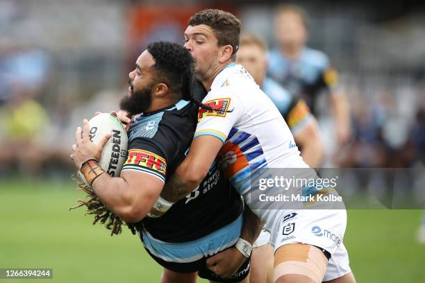 Siosifa Talakai of the Sharks is tackled by Ashley Taylor of the Titans during the round 14 NRL match between the Cronulla Sharks and the Gold Coast...
