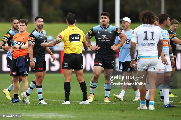 Shaun Johnson of the Sharks talks to Kevin Proctor of the Titans following an incident involving an alleged bite by Proctor during the round 14 NRL...