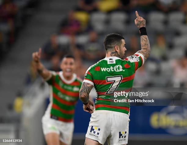 Adam Reynolds of the Rabbitohs celebrates after kicking the winning field goal during the round 14 NRL match between the North Queensland Cowboys and...