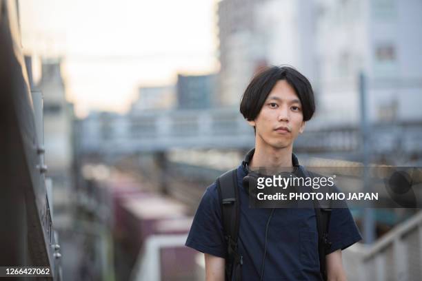 a millennial man living in the suburban city in japan - cultura della gioventù foto e immagini stock
