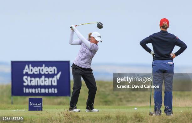 Stacy Lewis of The United States plays her tee shot on the 15th hole watched by Azahara Munoz of Spain during the third round of the Aberdeen...