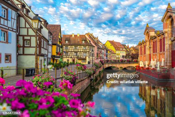 spectacular colorful traditional french houses on the side of river lauch in petite venise,colmar,france - alsatian stock pictures, royalty-free photos & images