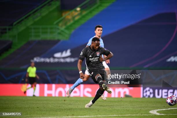 Moussa Dembele of Olympique Lyon scores his team's second goal during the UEFA Champions League Quarter Final match between Manchester City and Lyon...