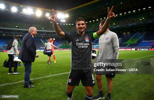 Houssem Aouar of Olympique Lyon celebrates following his team's victory in the UEFA Champions League Quarter Final match between Manchester City and...