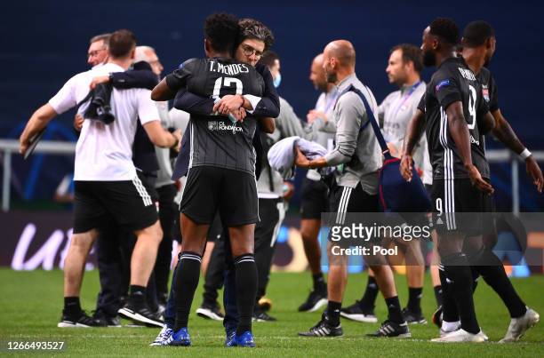 Juninho Pernambucano, Sporting Director of Olympique Lyon and Thiago Mendes of Olympique Lyon celebrate following their team's victory in the UEFA...