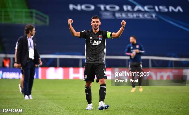 Houssem Aouar of Olympique Lyon celebrates following his team's victory in the UEFA Champions League Quarter Final match between Manchester City and...
