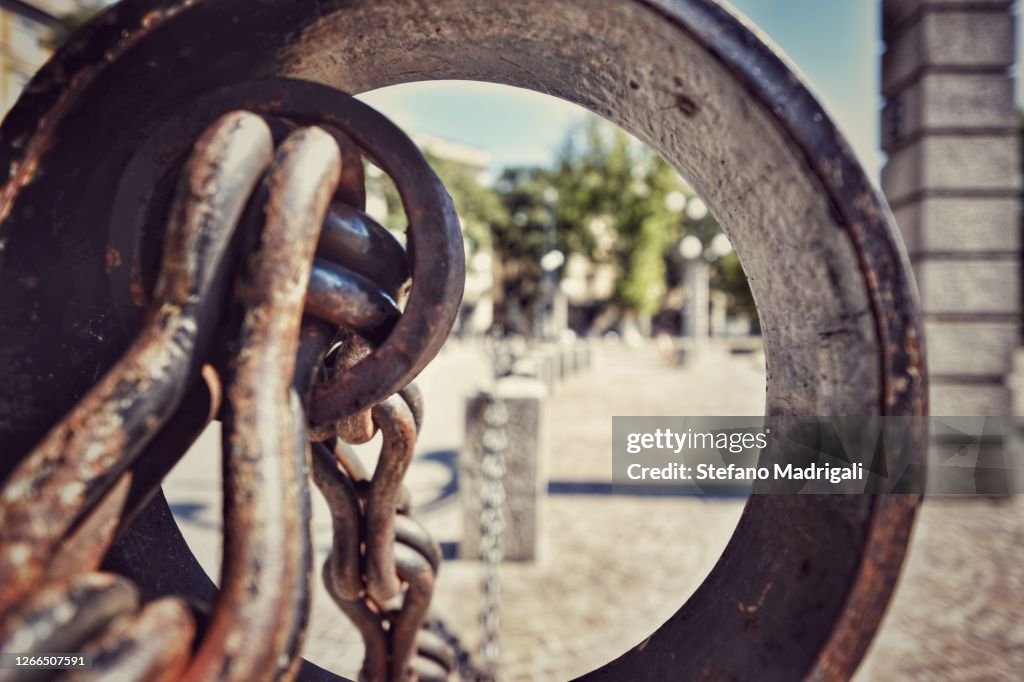 Rusty link of the historical chain in the city