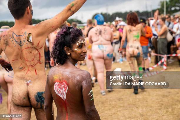 Graphic content / People take part in the annual nude race at Roskilde Festival in the Camping Area Dream City, Roskilde, Denmark, on June 29, 2023 /...