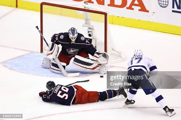 Alex Killorn of the Tampa Bay Lightning scores a goal past Joonas Korpisalo of the Columbus Blue Jackets during the first period in Game Three of the...