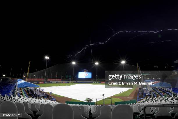 Lightning strikes while on a rain delay during the fourth inning of an MLB game between the Toronto Blue Jays and the Tampa Bay Rays at Sahlen Field...