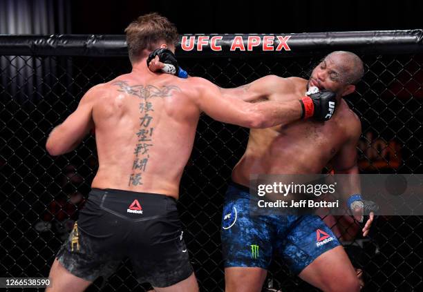 Stipe Miocic punches Daniel Cormier in their UFC heavyweight championship bout during the UFC 252 event at UFC APEX on August 15, 2020 in Las Vegas,...